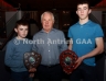 North Antrim Treasurer Chris Campbell presents the North Antrim Under 14 B Championship trophy to Niall McGarrell (left) and the Under 14 Division 2 League trophy to Aidan Scullion, both of Glenarm Shane O’Neill’s