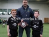 North Antrim Youth Development Officer Declan Heggarty presenting All Saints, Ballymena joint captains Aidan McGarry and Kevin O’Boyle with the North Antrim U12 Division 3 Airborne Hurling League Shield.
