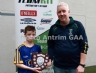 North Antrim Youth Development Officer Paddy Gray presenting St Eargnats Team Captain Sean Boyd with the TeamKit U12 Division 3 Airborne Hurling League Shield