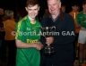 Malachy Darragh presentring Dunloy Cuchullians captain Aiden McKenna with the Darragh Cup Trophy