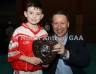 Philip McHendry from Central Restaurant Ballycastle presenting Shamrocks 1 team captain Cian Higgins with the North Antrim Central Bar Division 2 Indoor Hurling league shield