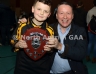 Philip McHendry from Central Restaurant Ballycastle presenting McQuillians1 team captain Ruairi McShane with the North Antrim Central Bar Division 1 Indoor Hurling league shield