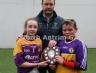 North Antrim Youth Development Officer Declan Heggarty presenting Naomh Padraig joint captains Cassie McCarthy and John V Morgan with the North Antrim U12 Division 2 Airborne Hurling League Shield.