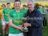 Malachy Darragh presentring Dunloy Cuchullians captain Conor Kinsella with the Darragh Cup Trophy