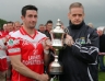 North Antrim Chairman Owen Elliott presents the Senior Feis Cup to Loughgiel Captain Eddie McCloskey