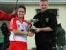 Loughguile Shamrocks Team Captain Cara McIntyre pictured with North Antrim GAA Chairman Owen Elliott