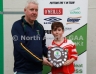 North Antrim Youth Development Officer Paddy Gray presenting Loughgiel Shamrocks Team Captain Tiago McGarry with the TeamKit U12 Division 1 Airborne Hurling League Shield